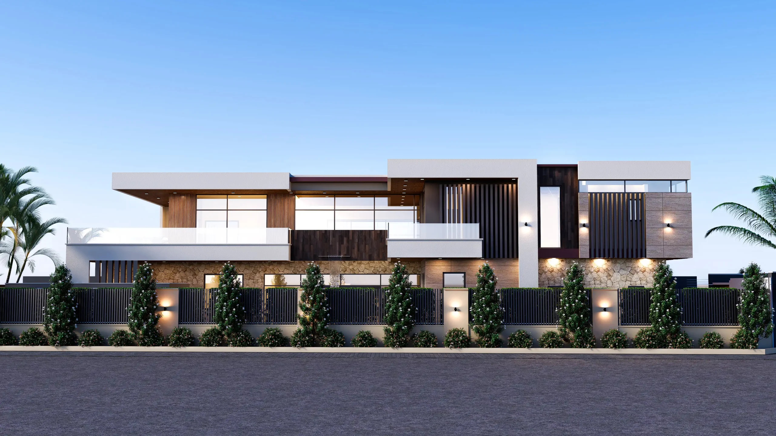 Vue de face d'une résidence contemporaine en R+1 avec façade en pierre, bardage bois foncé et éclairage architectural, entourée d'un mur végétalisé